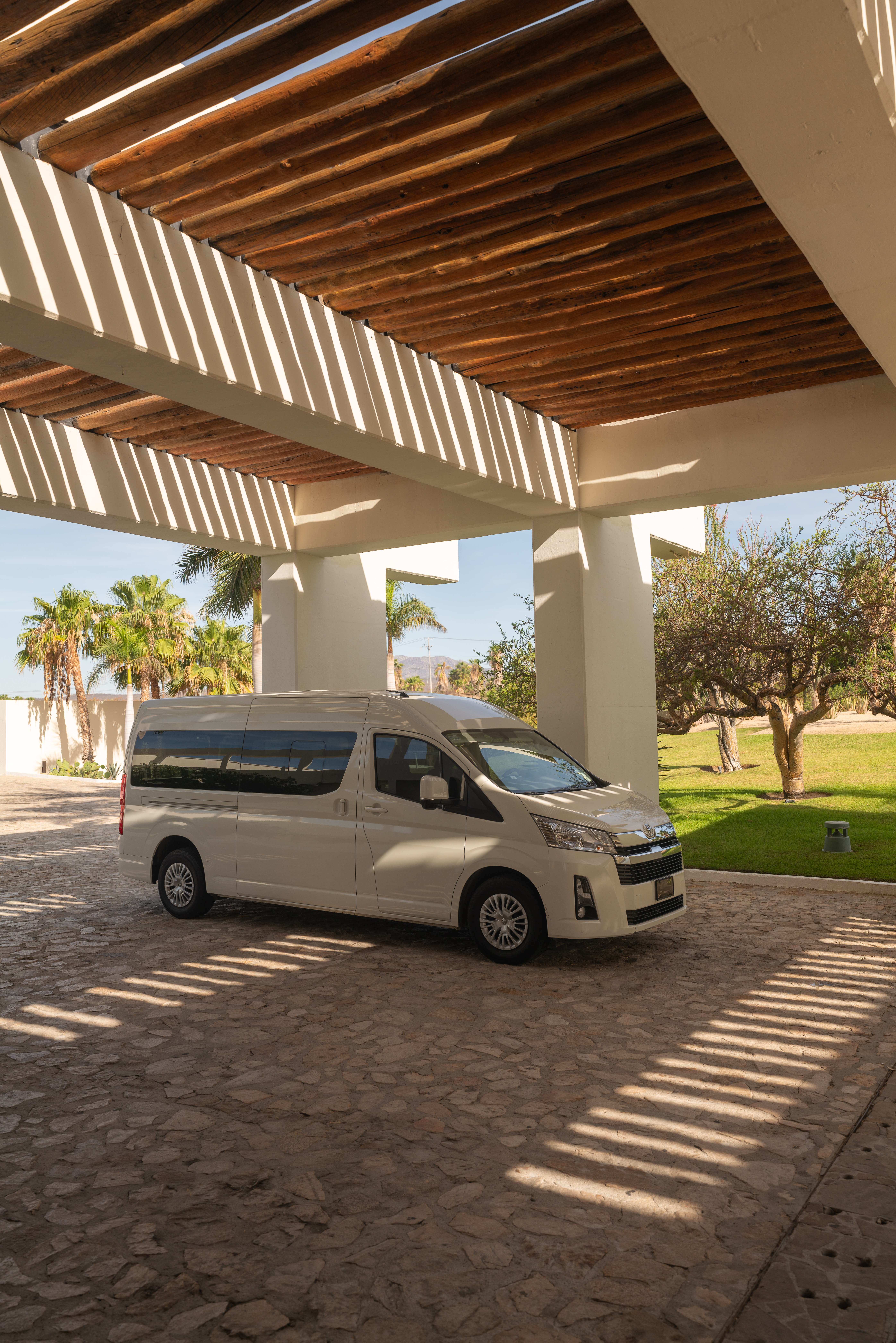 a white van parked under a covered patio