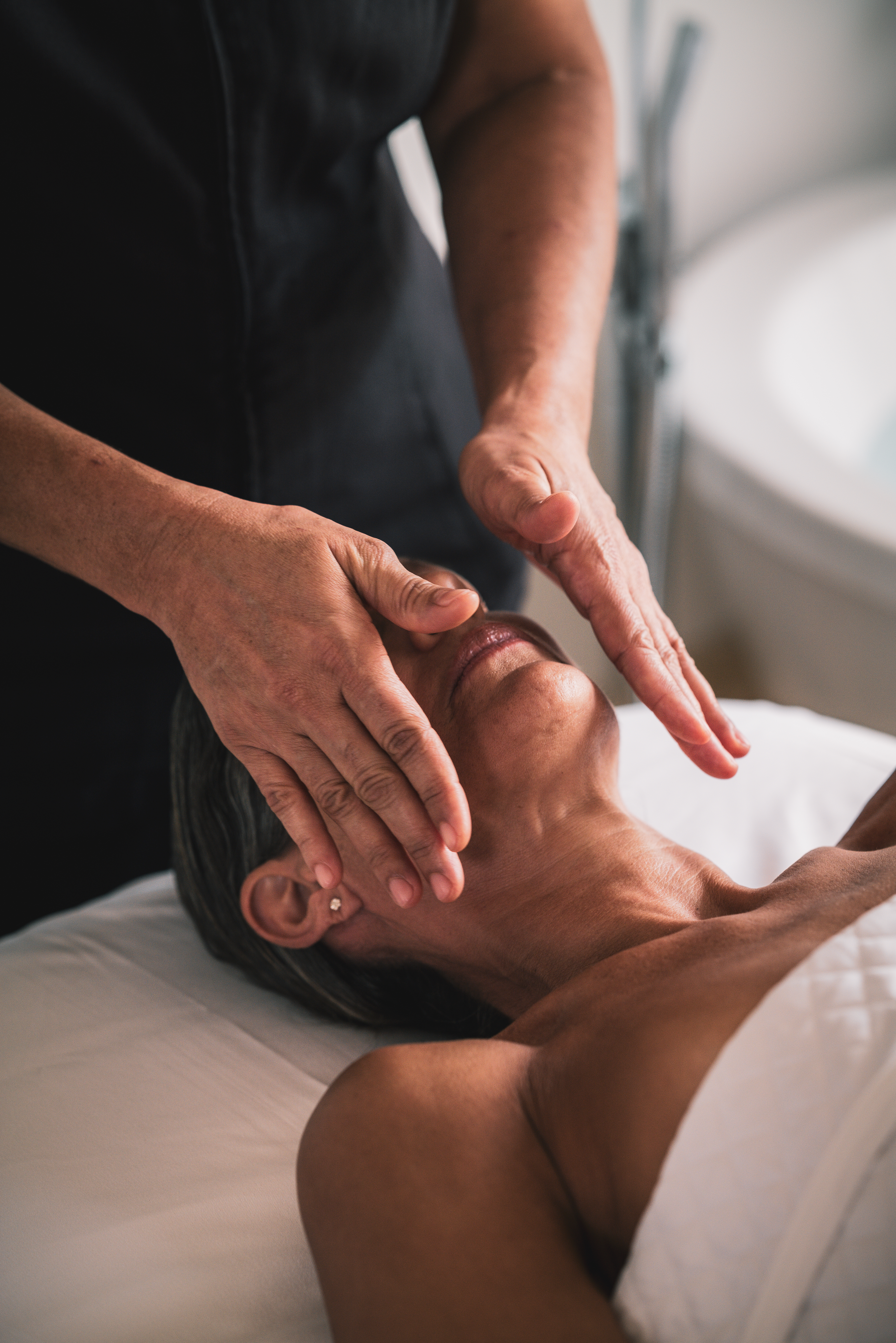 a person doing a face massage