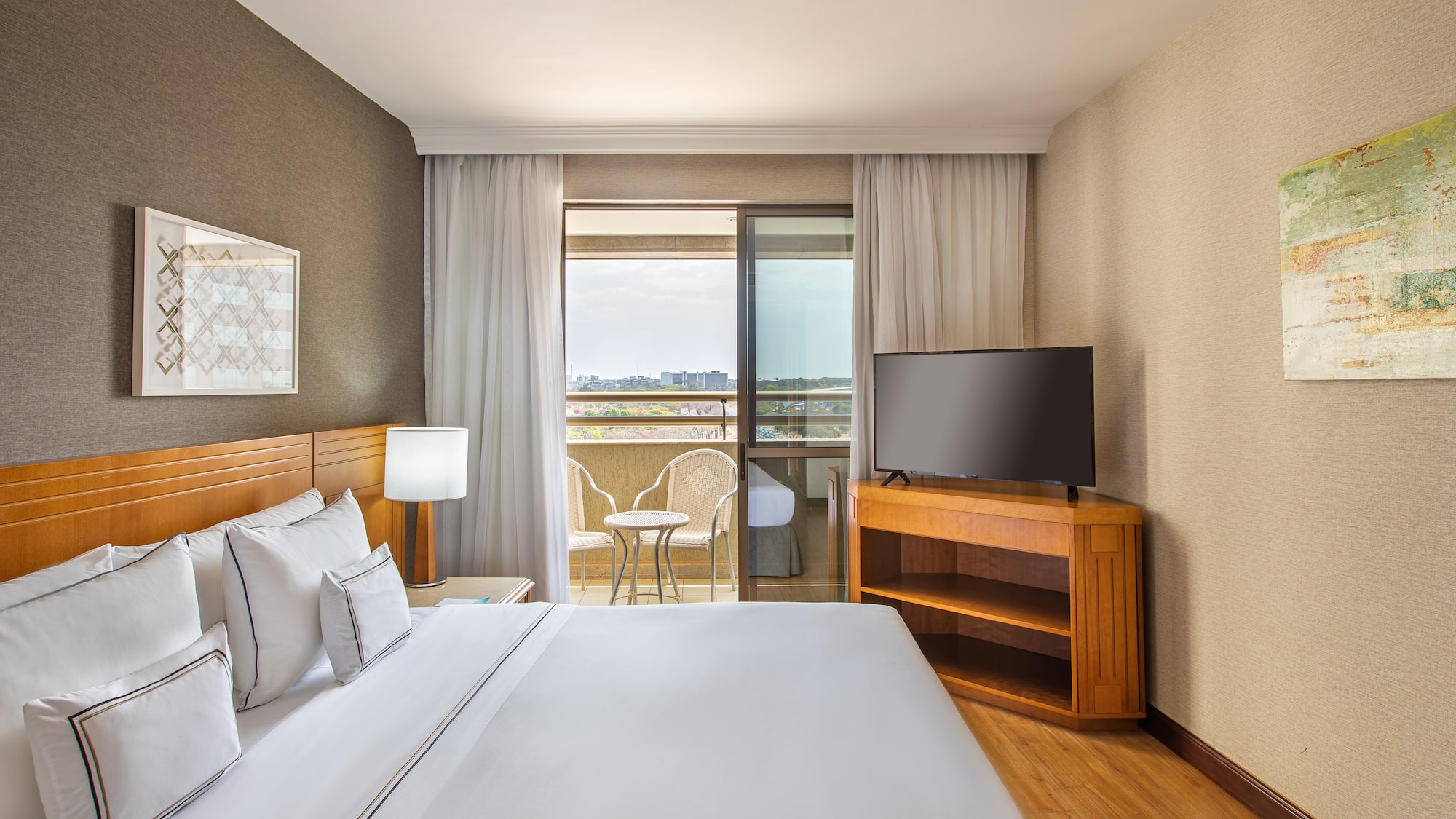 a room with a bed and a television