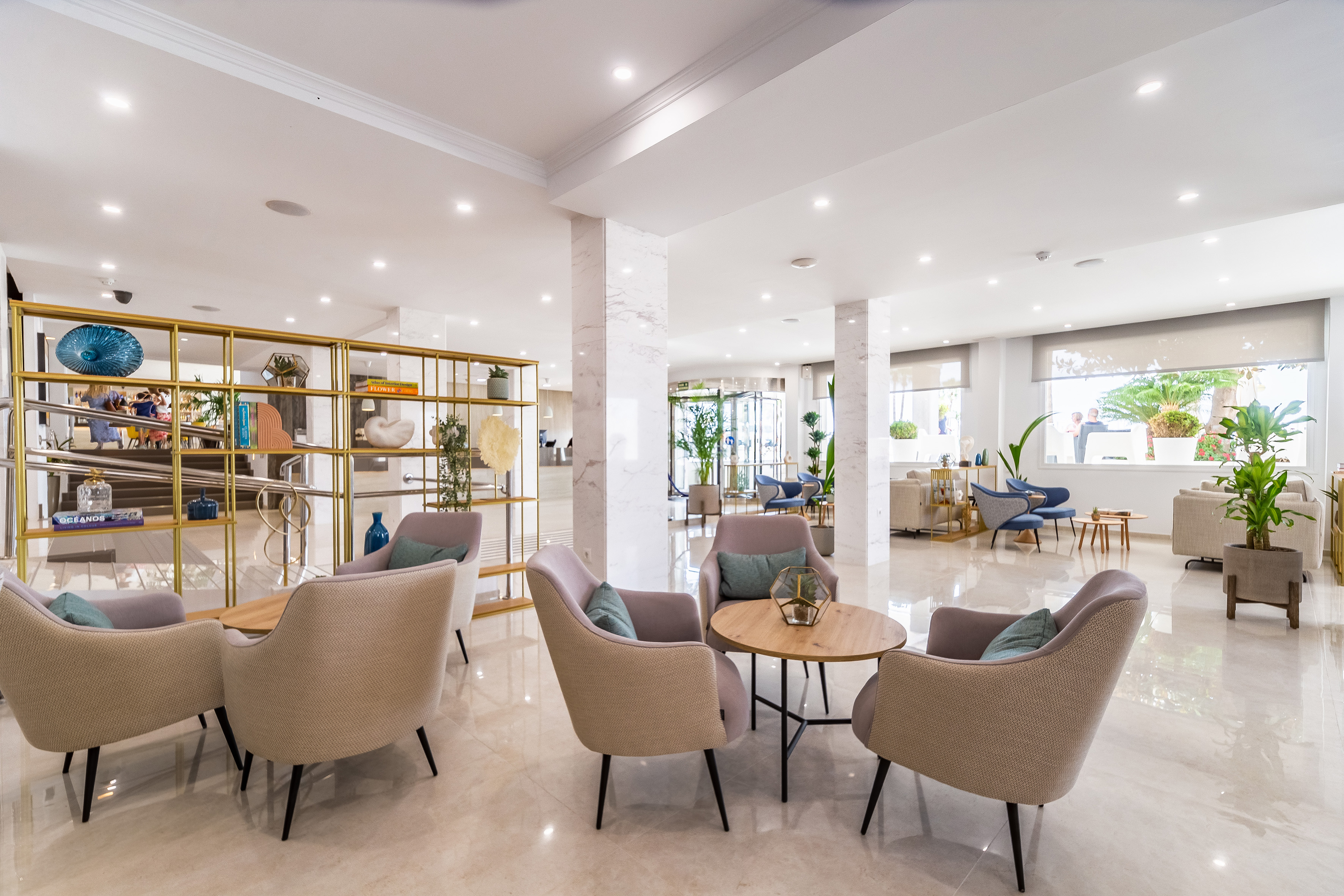 Modern hotel lobby lounge with comfortable seating and stylish decor.