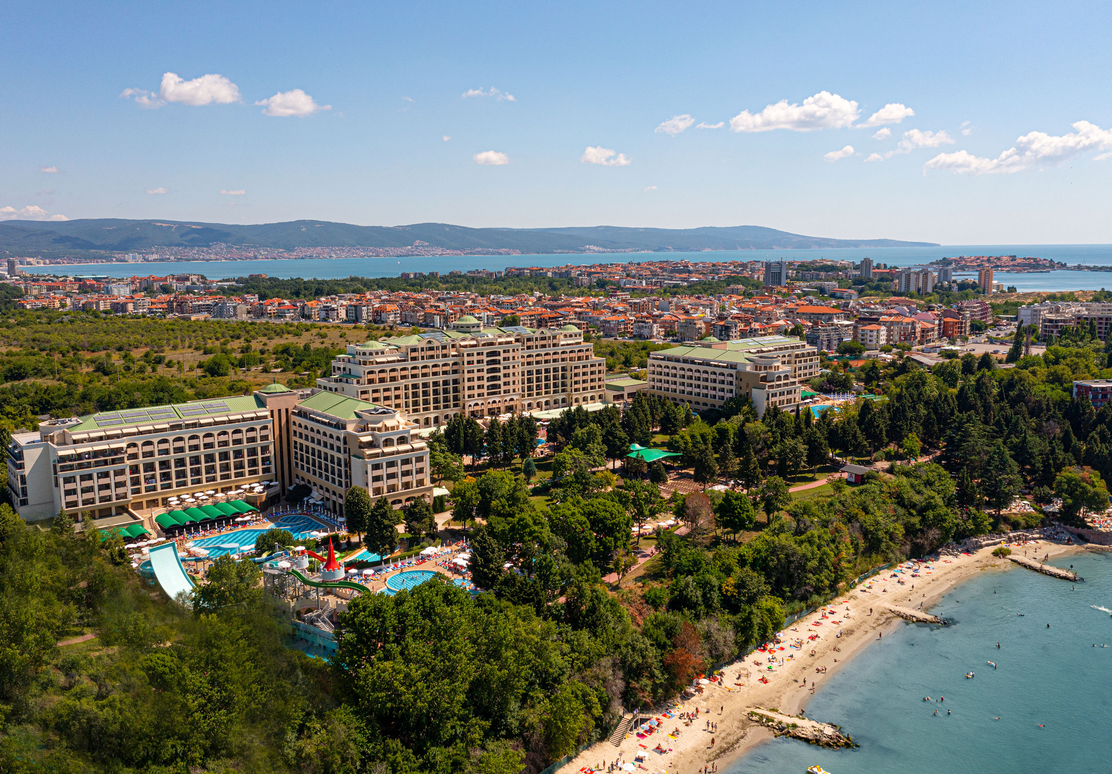 a large building next to a beach