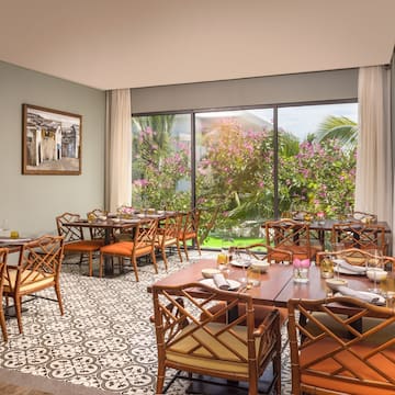 a restaurant with tables and chairs