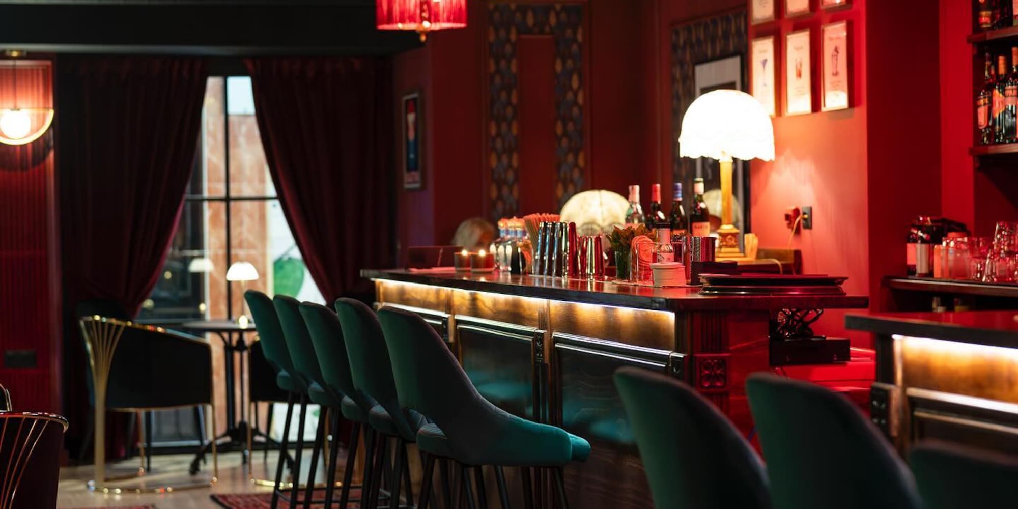 a bar with chairs and a table