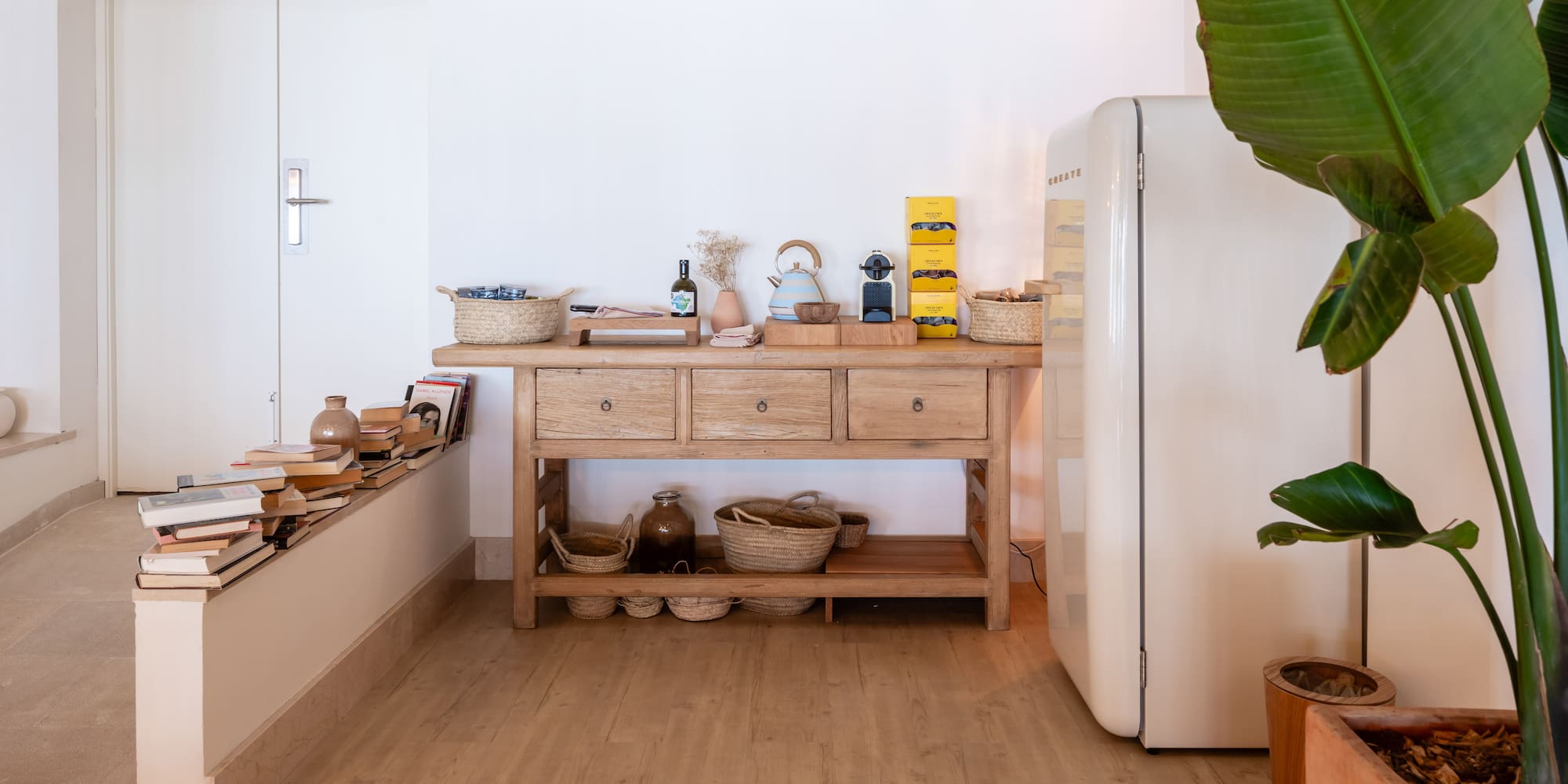 a kitchen with a white refrigerator and a table