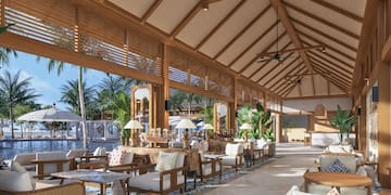 a large room with tables and chairs