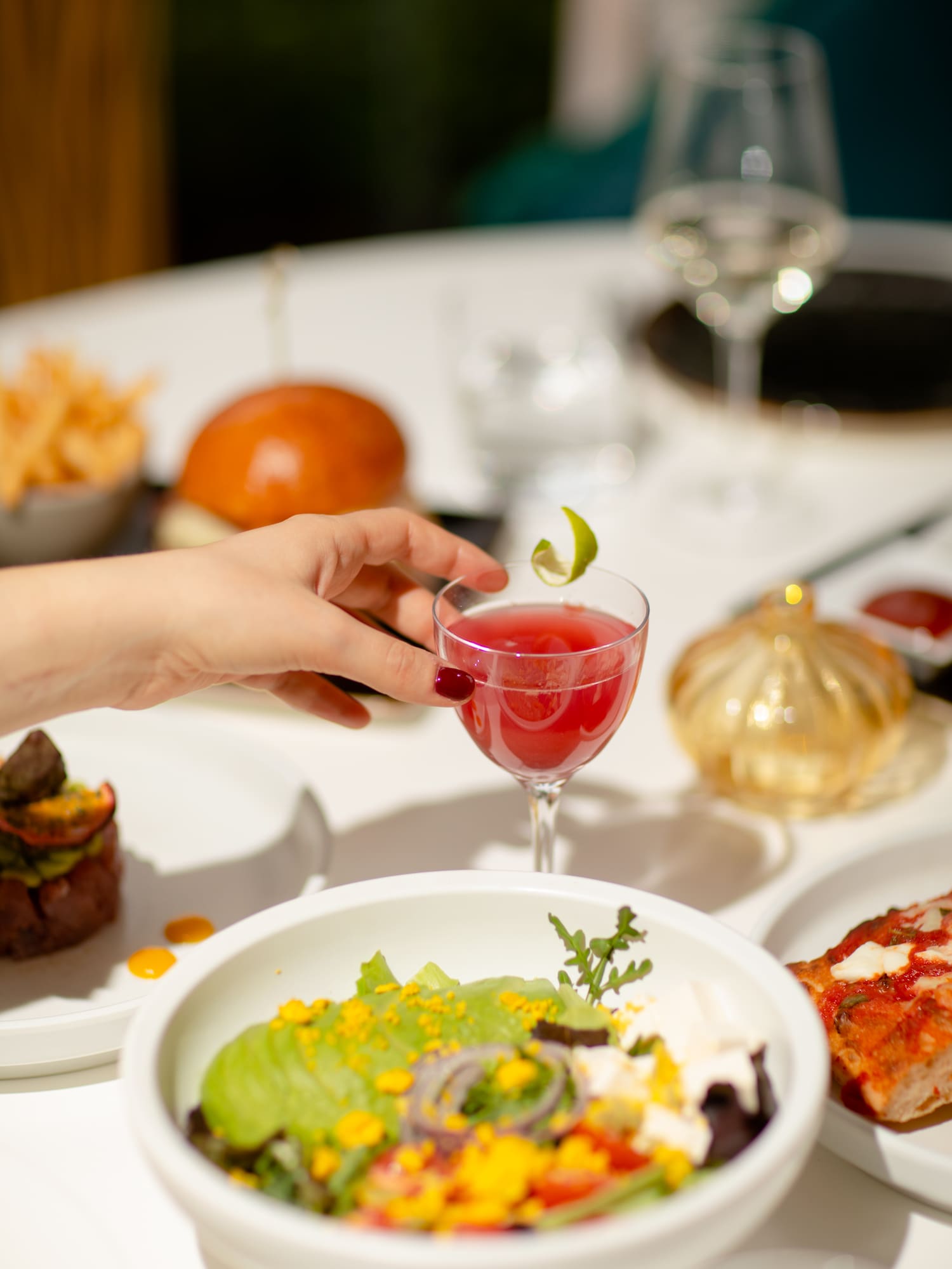 a hand holding a drink