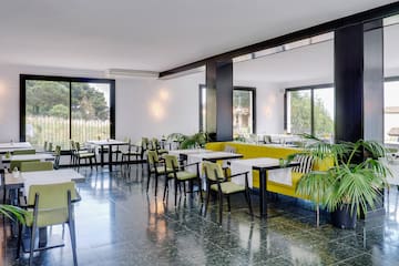 a room with tables and chairs