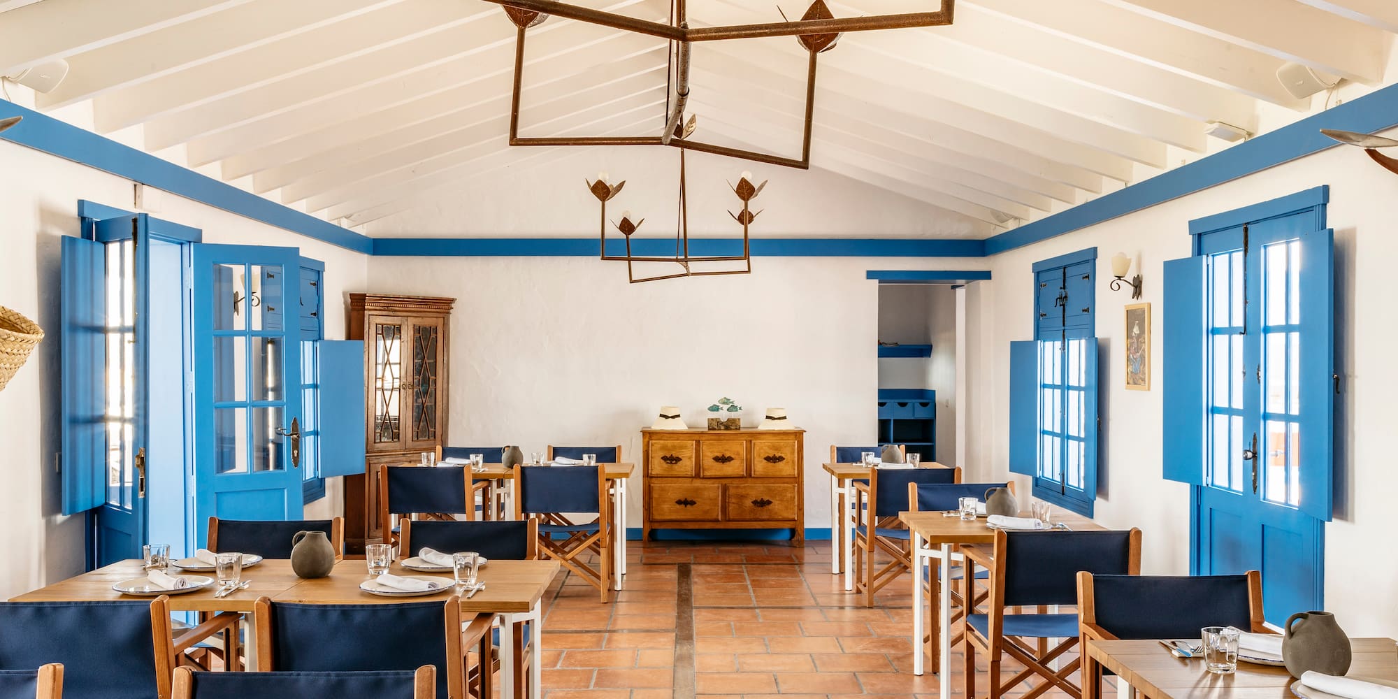 a room with blue and white furniture