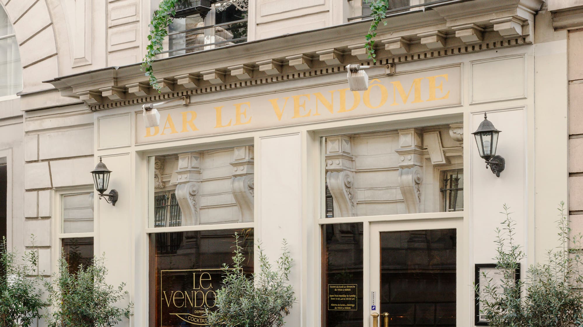 a building with windows and plants