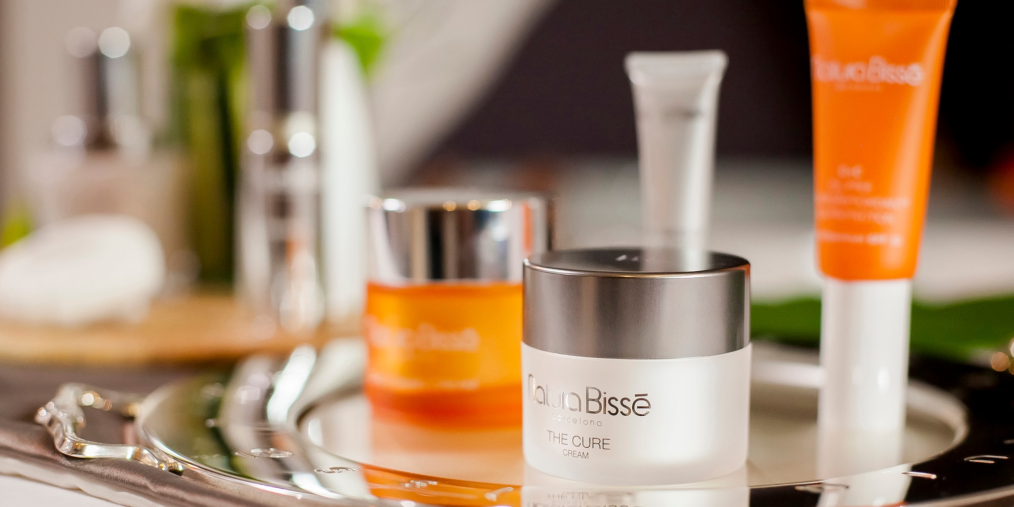 a group of cosmetic containers on a tray