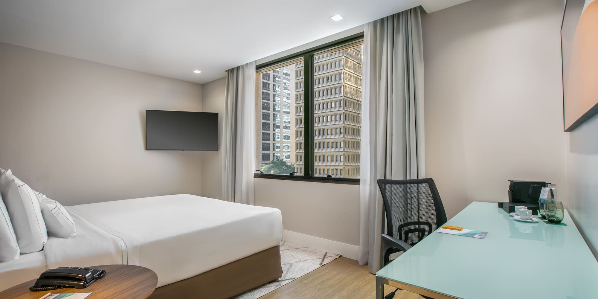 a room with a desk and a bed