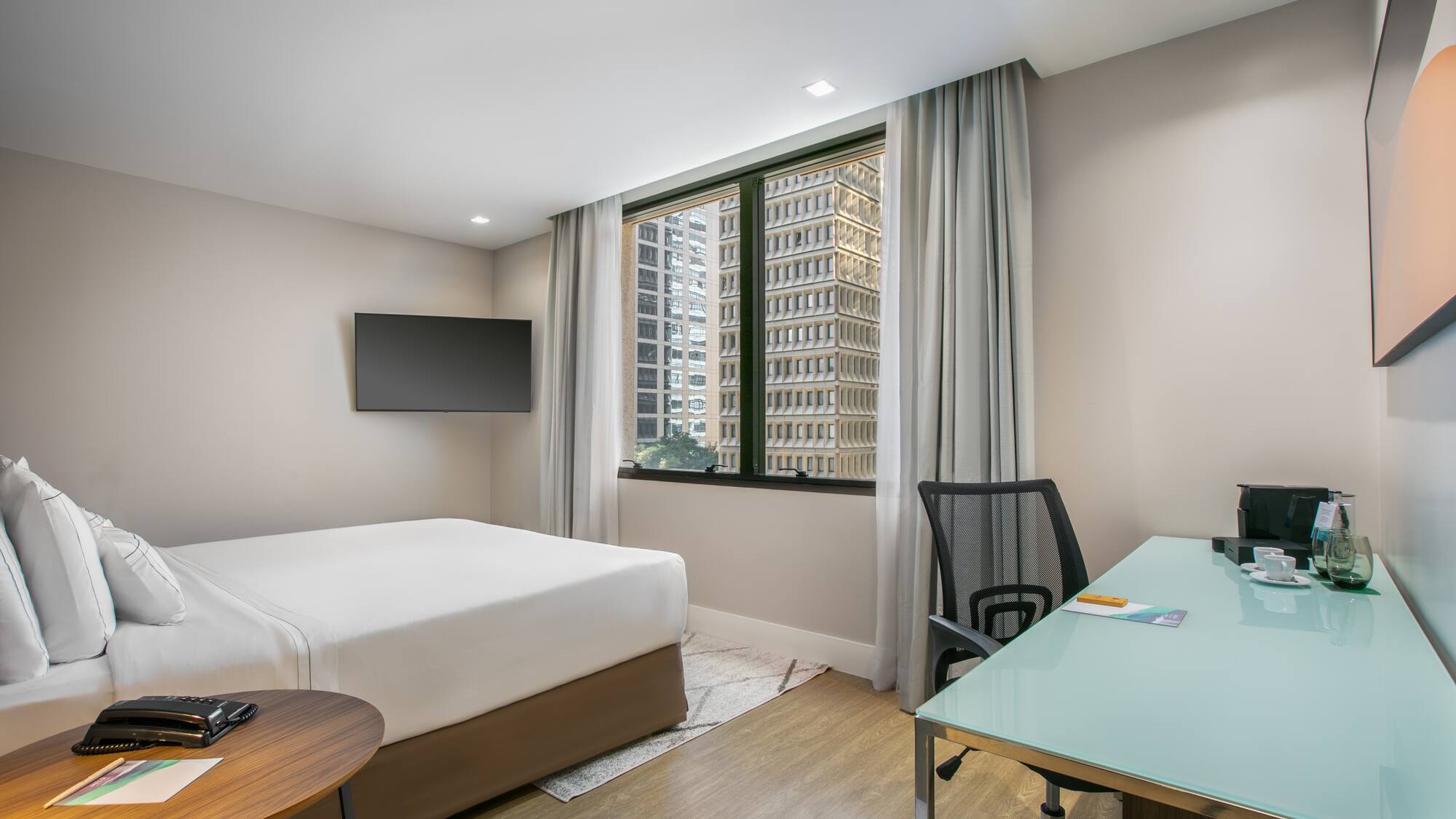 a room with a desk and a bed