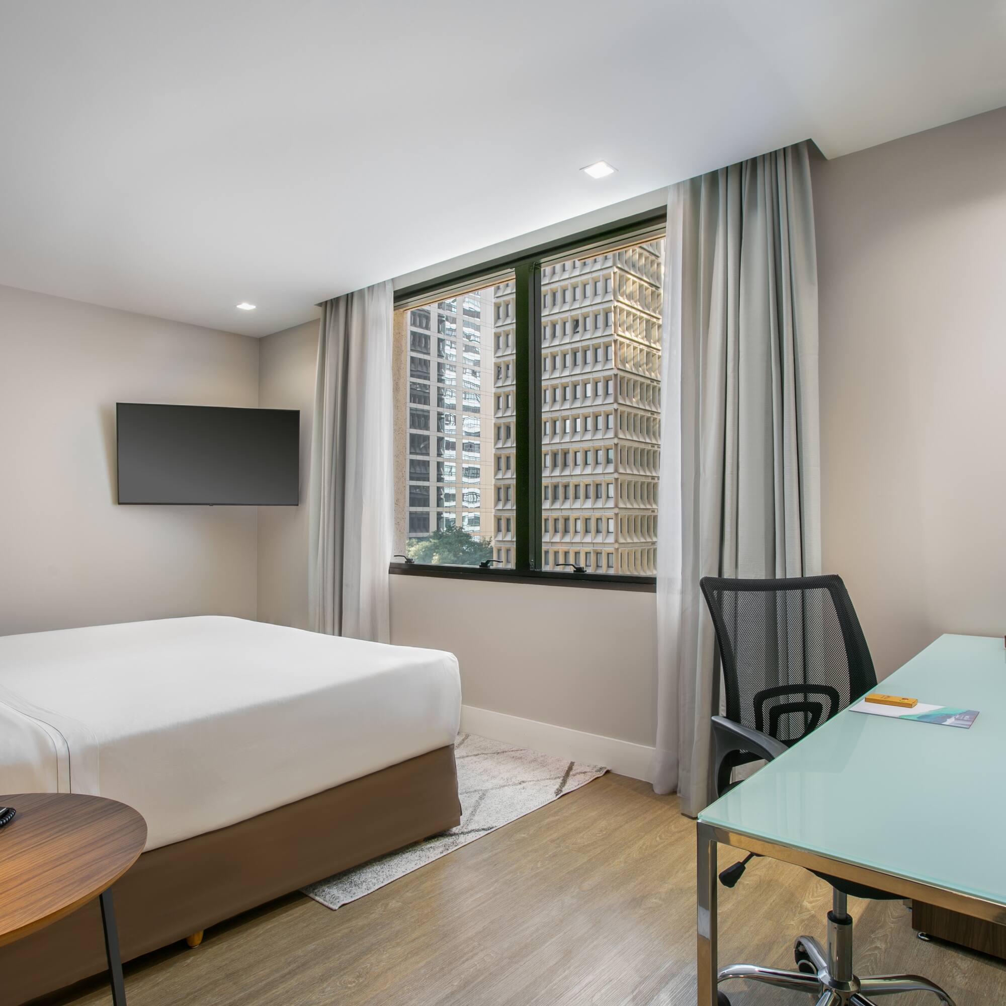 a room with a desk and a bed