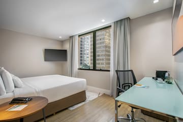 a room with a desk and a bed