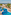 Resort hotel with winding blue pool, palm trees, sun loungers, ocean view.
