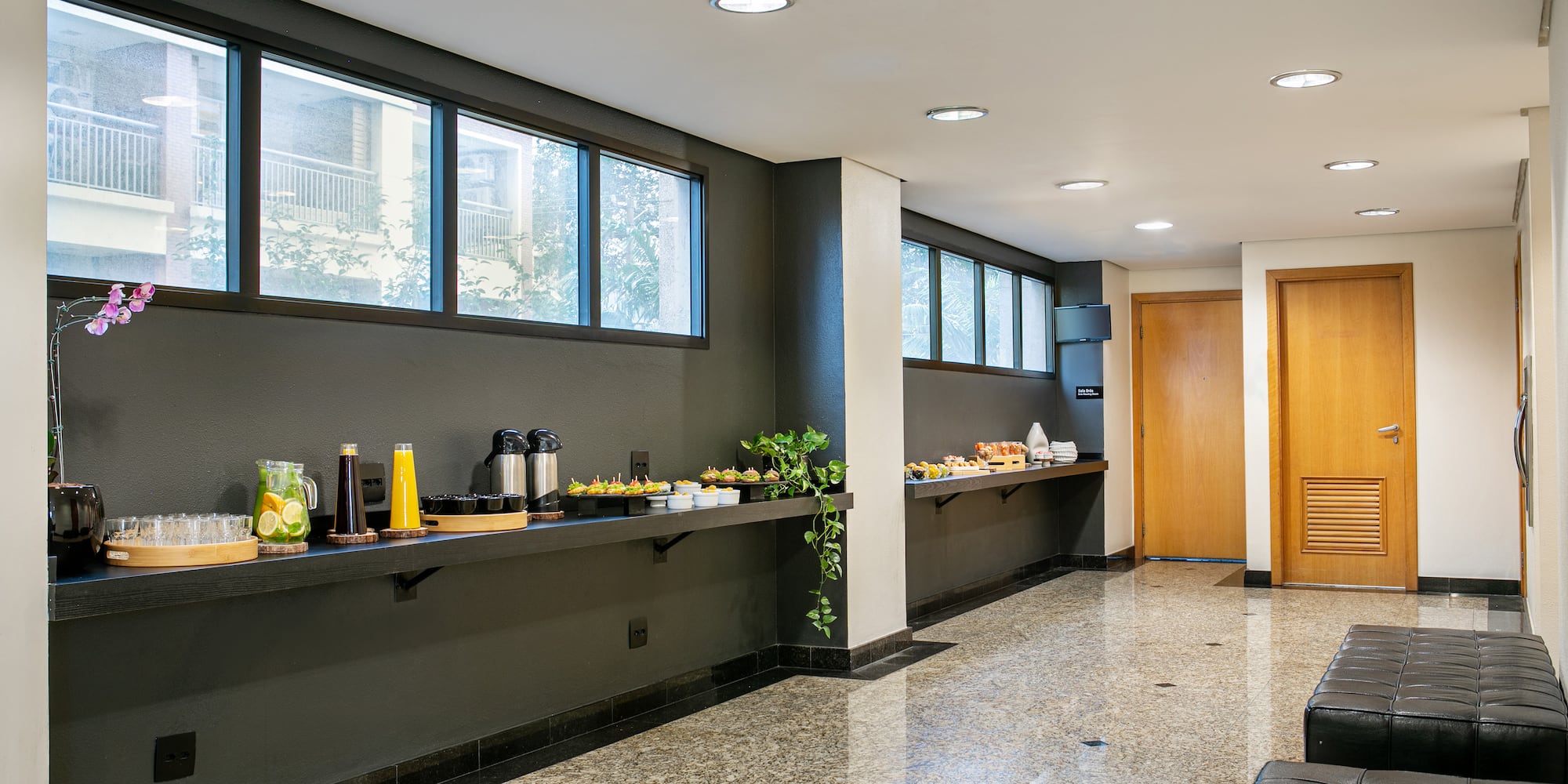 a room with a black couch and a black leather couch