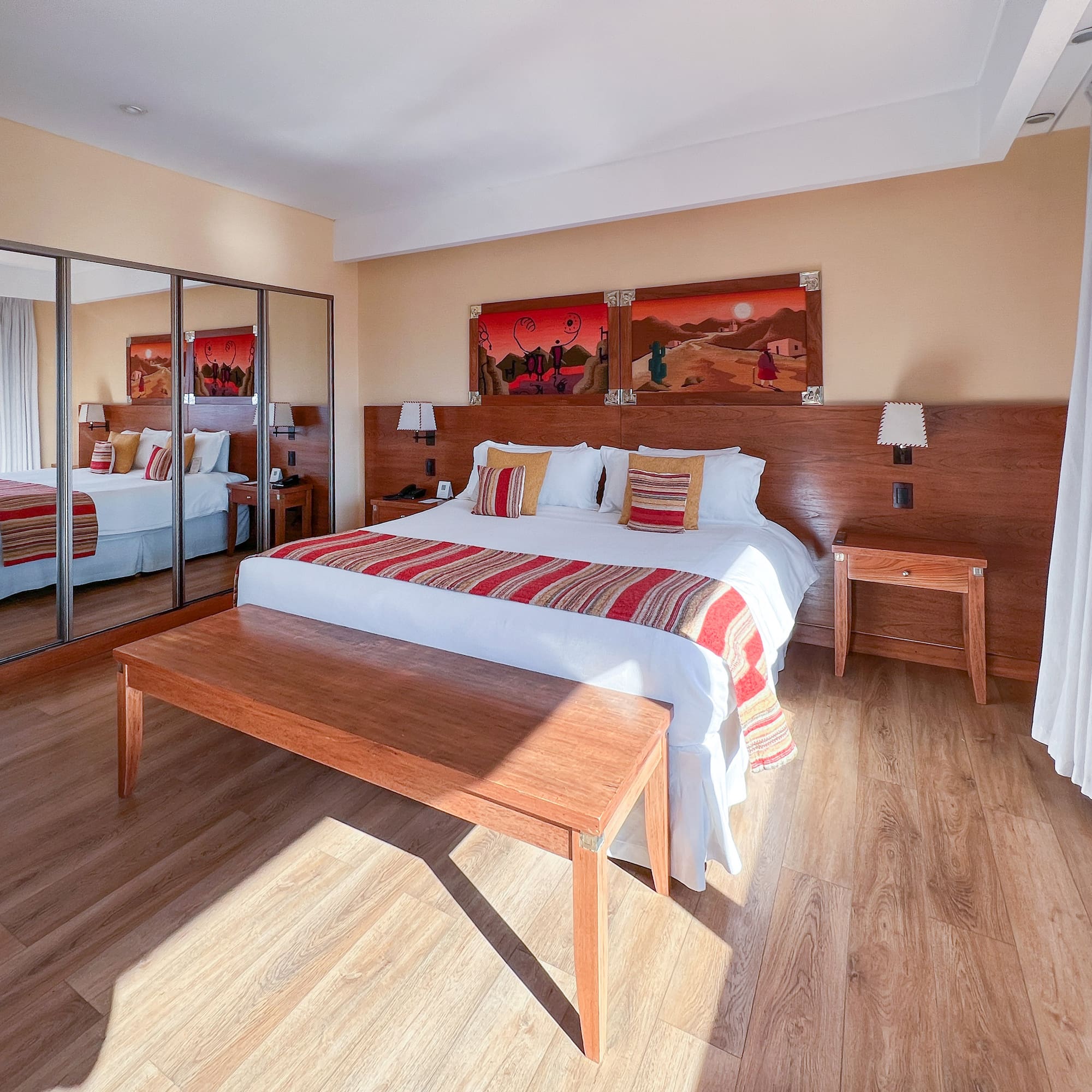 a room with a bed and mirror