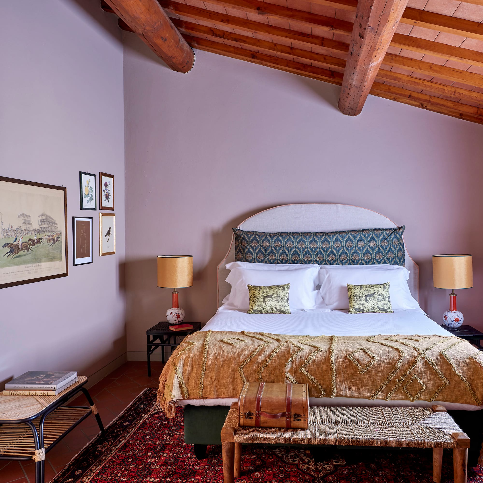 a bedroom with a bed and a rug