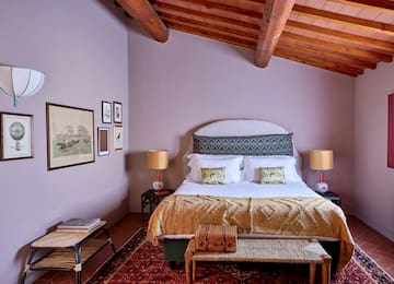 a bedroom with a bed and a rug