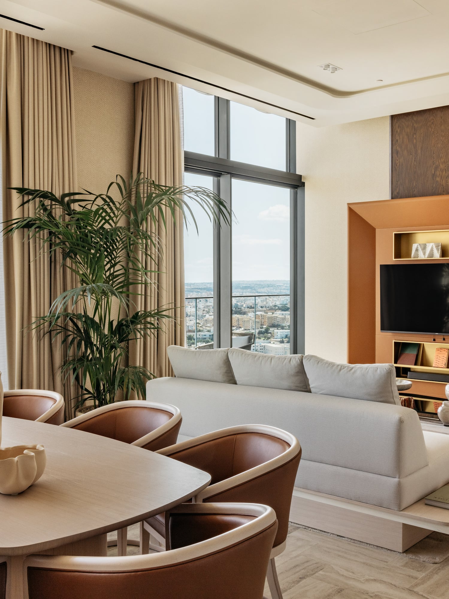 a living room with a tv and couches