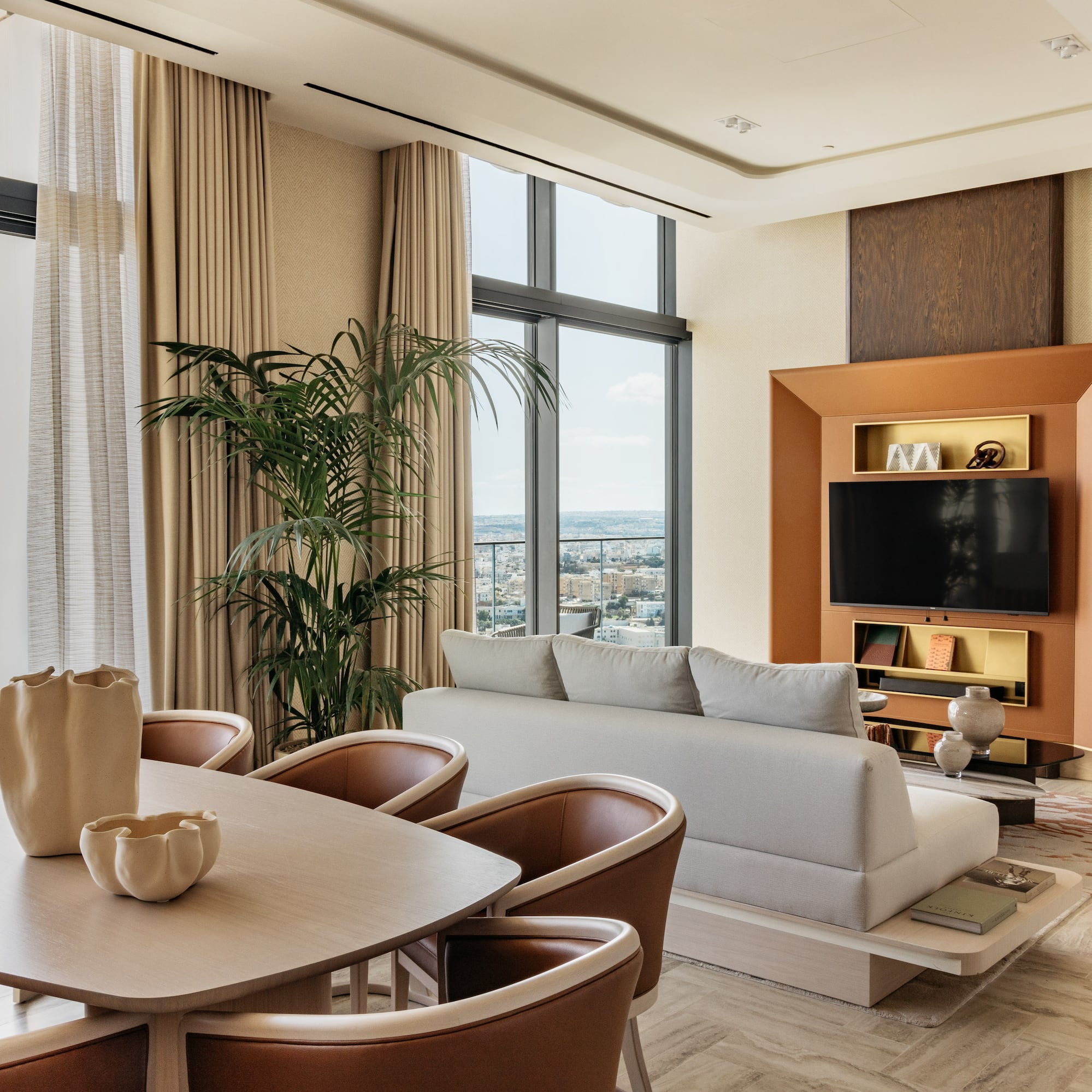 a living room with a tv and couches