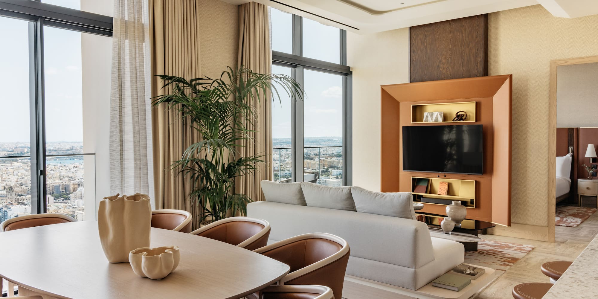 a living room with a tv and couches