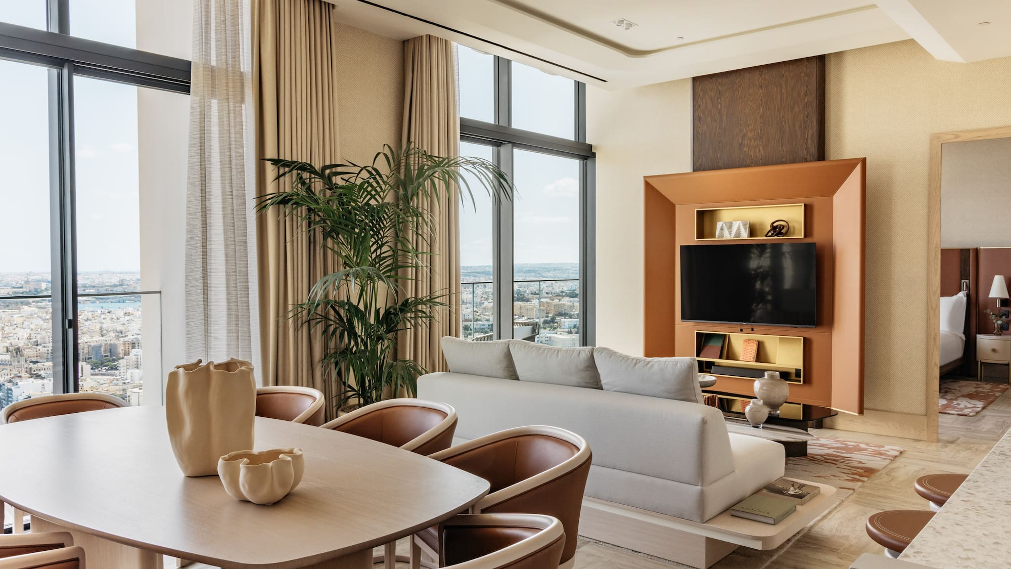 a living room with a tv and couches