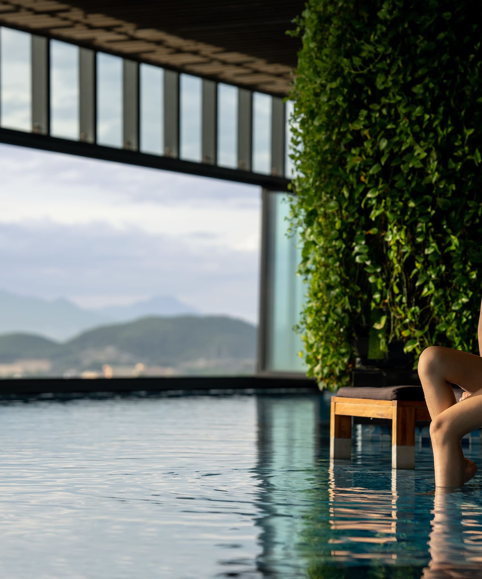 a woman sitting on a chair in a pool