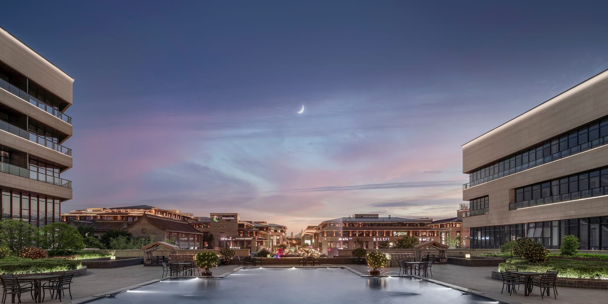 a large pool with a building in the background