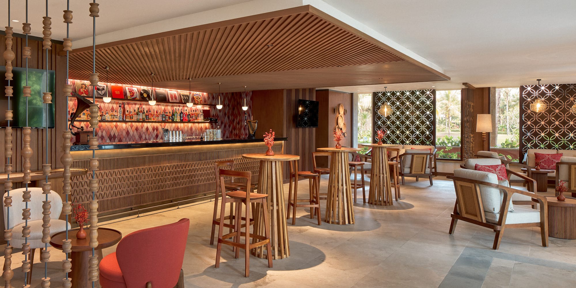 a room with a bar and chairs