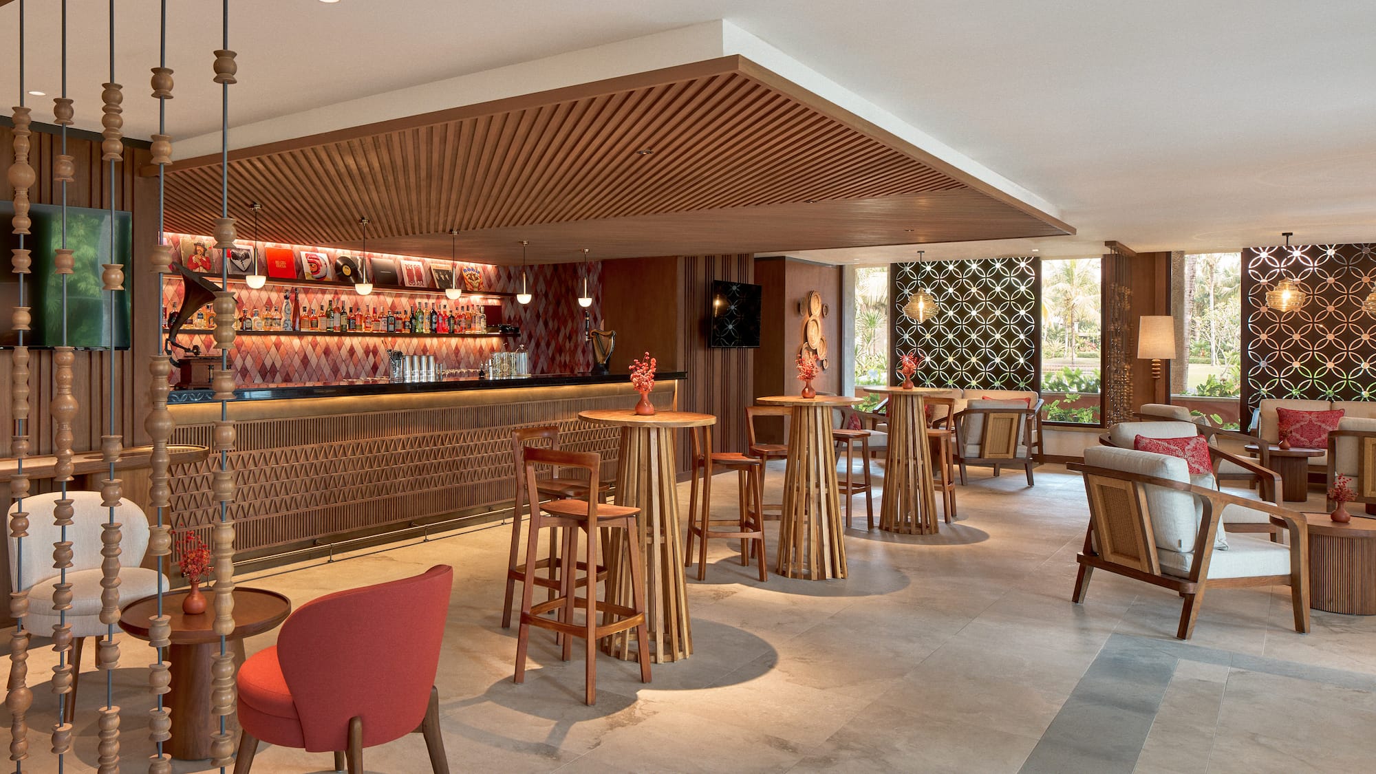 a room with a bar and chairs