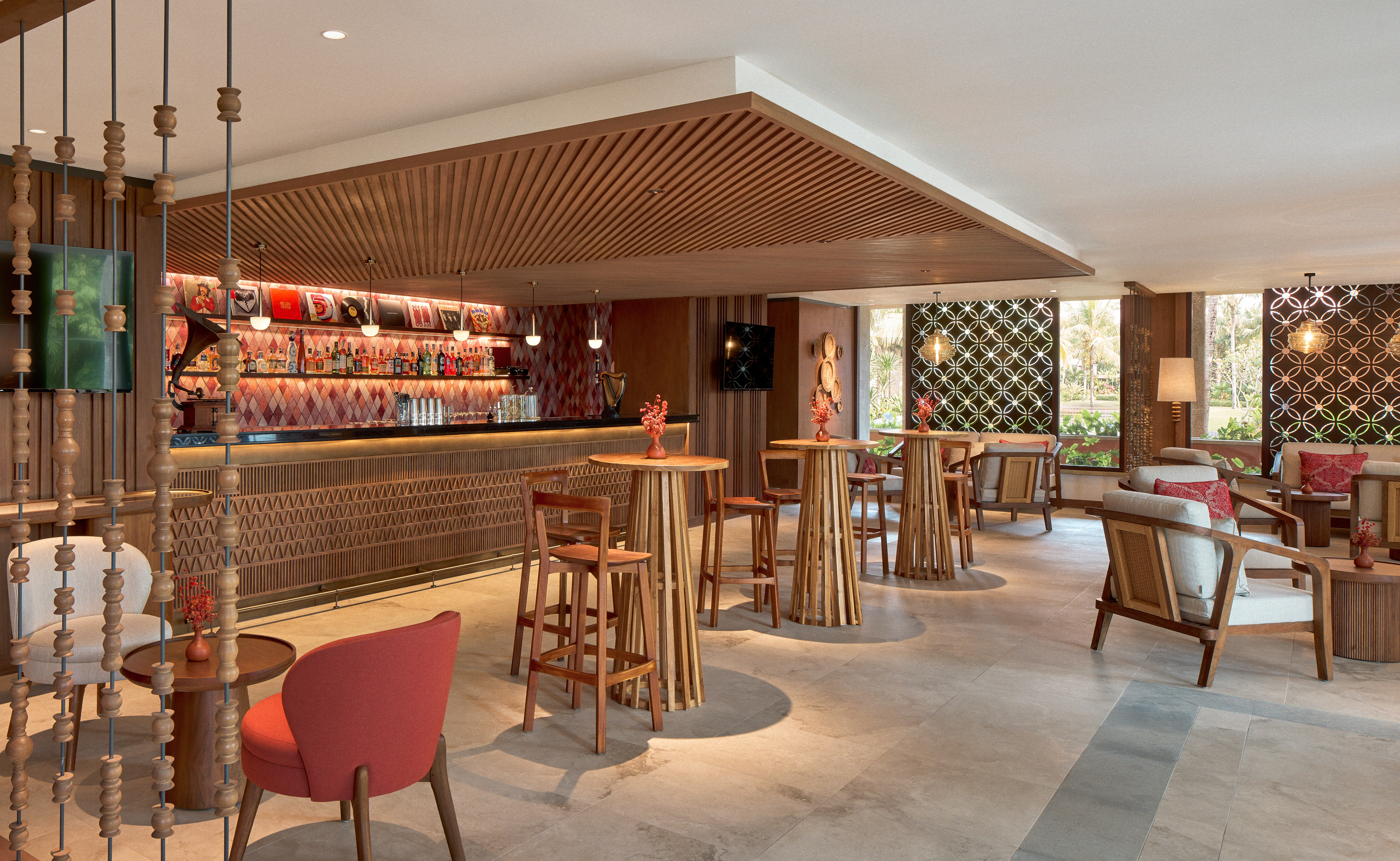 a room with a bar and chairs