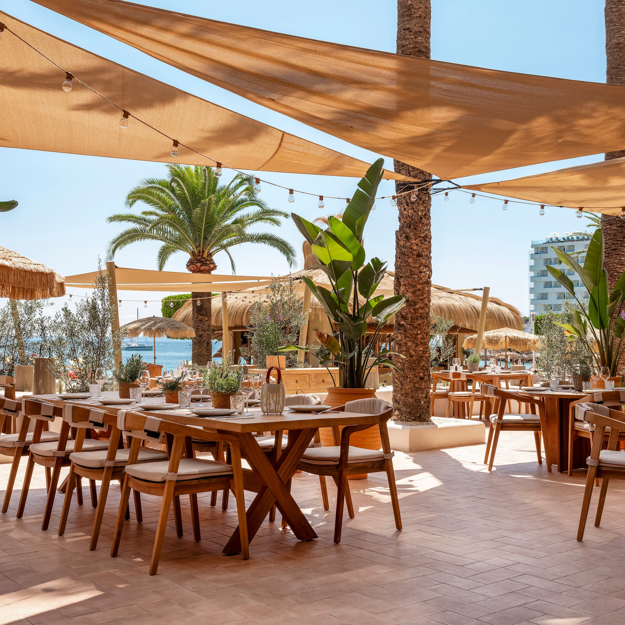 a tables and chairs under a shade