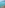 White catamaran on turquoise ocean, rocky coast, and green mountains.
