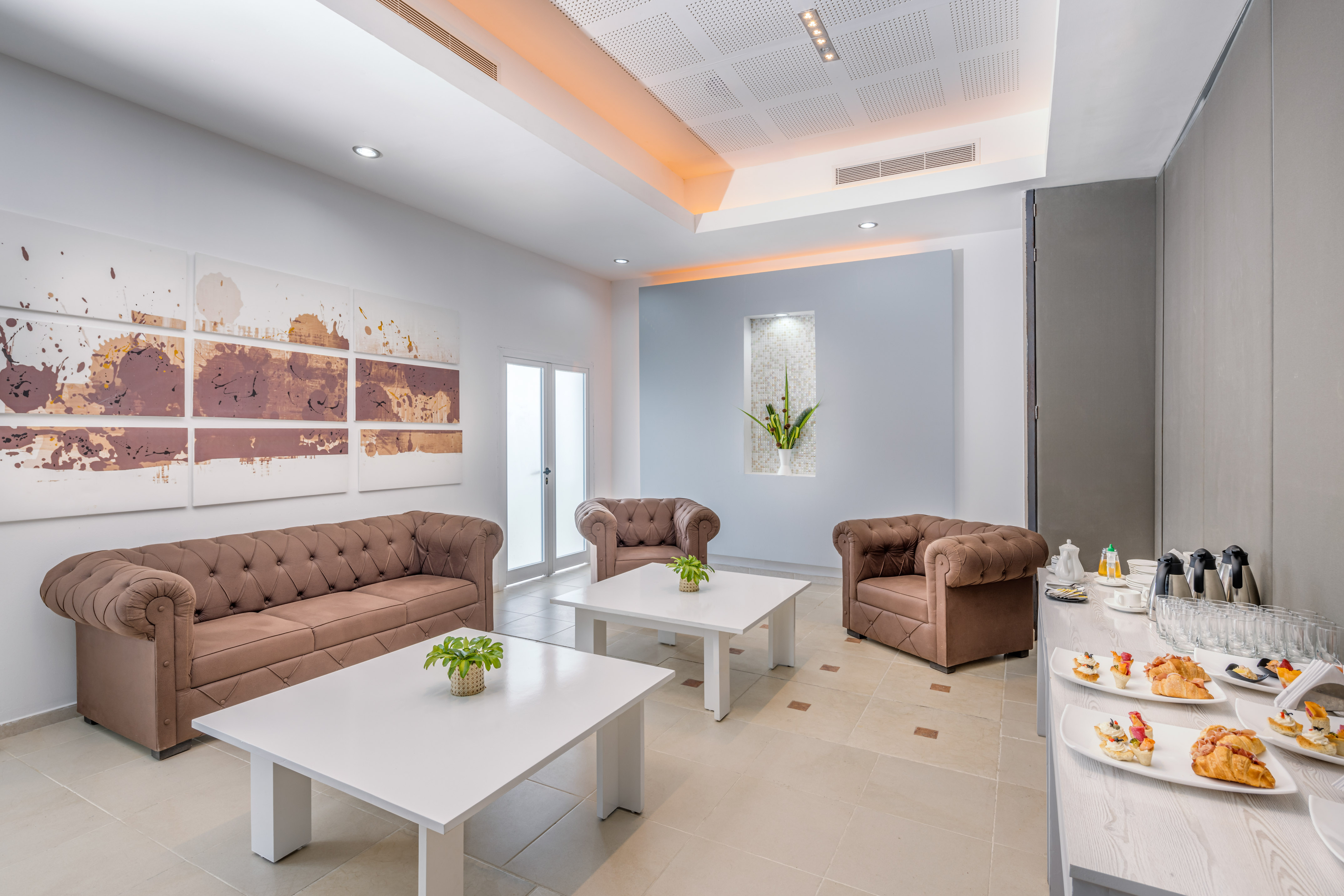 a room with couches and tables