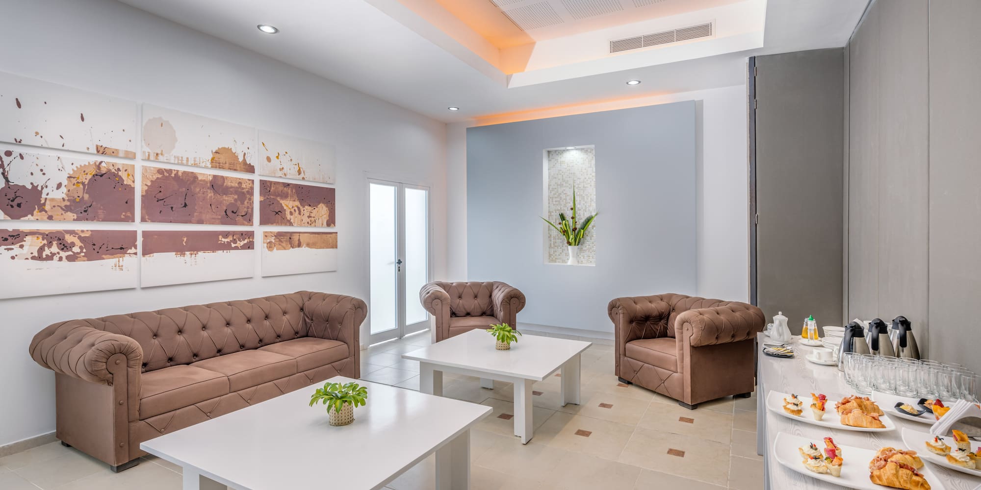 a room with couches and tables