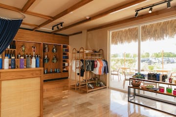 a store with a shelf and shelves with clothes