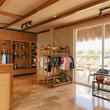 a store with a shelf and shelves with clothes