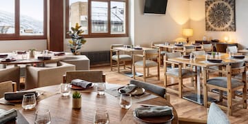 a room with tables and chairs