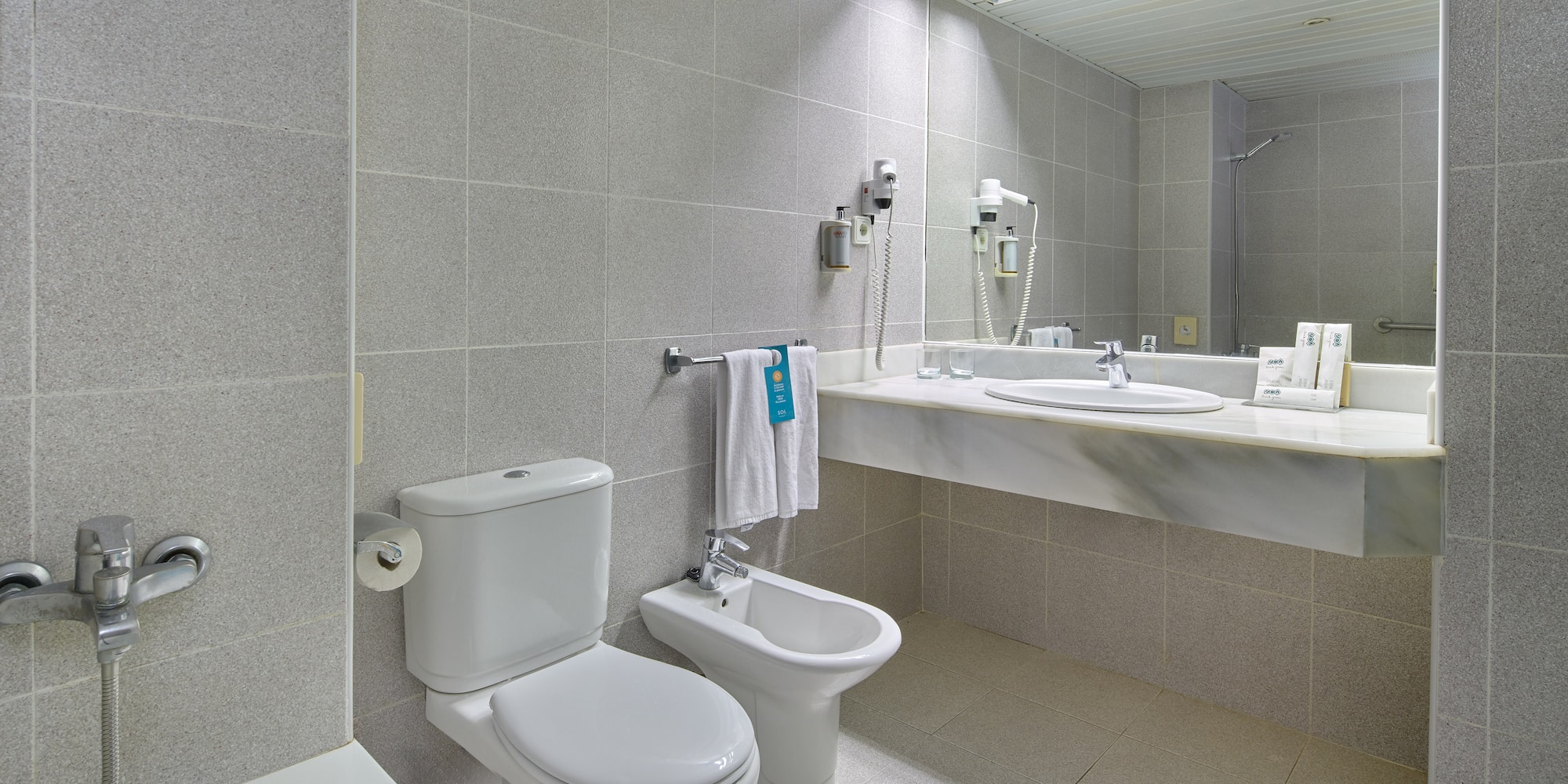 a bathroom with a sink and toilet