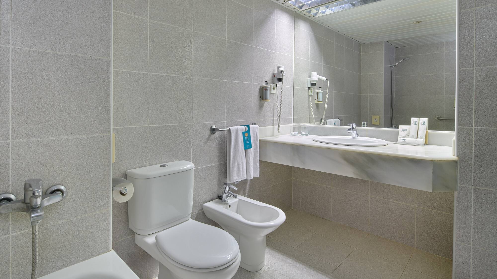 a bathroom with a sink and toilet