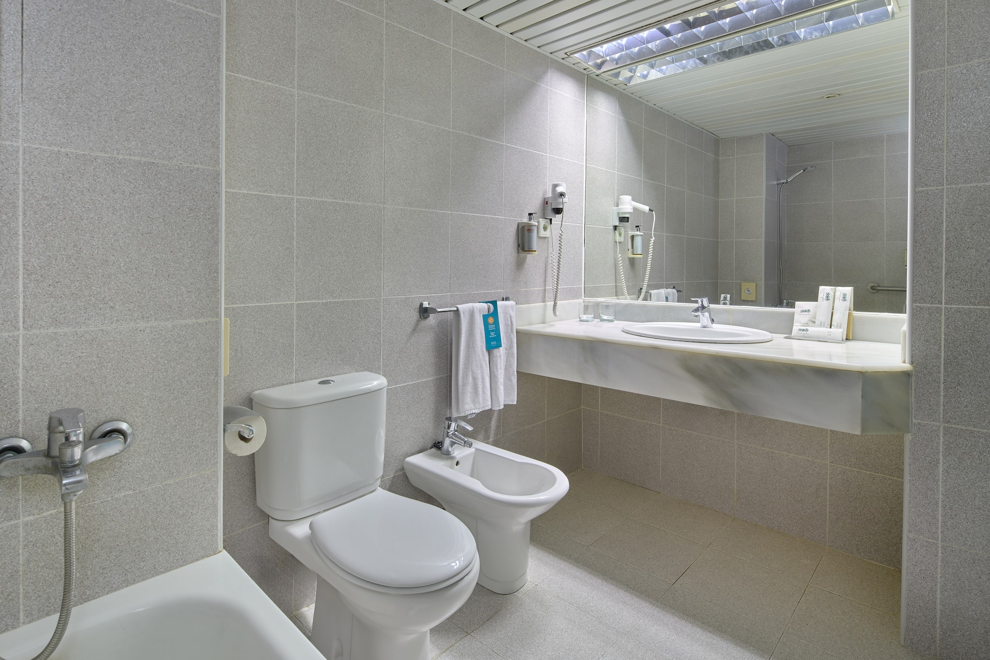a bathroom with a sink and toilet