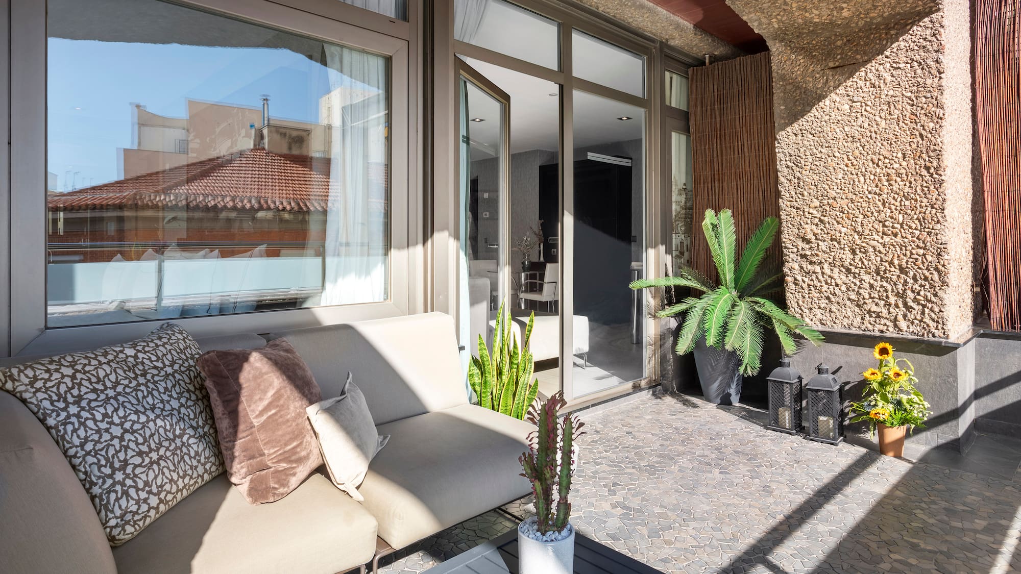 a couch and a table outside of a building