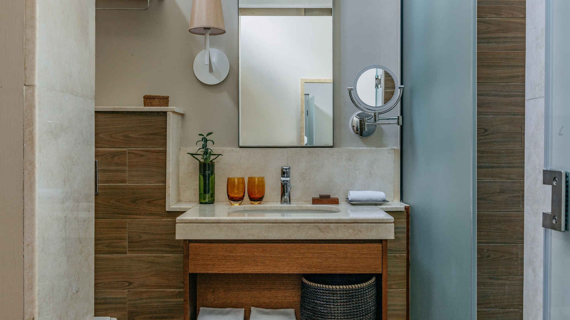 a bathroom with a mirror and sink