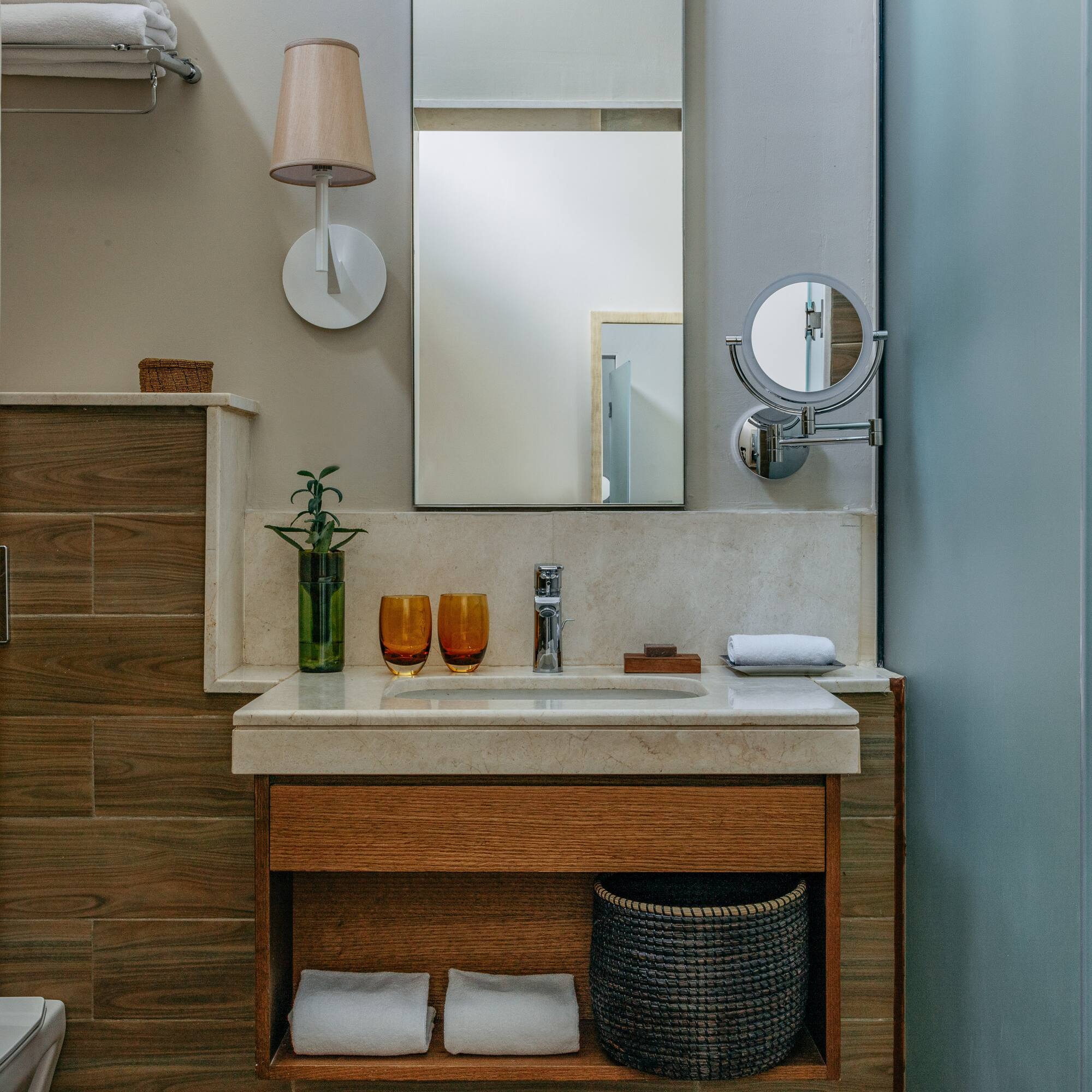 a bathroom with a mirror and sink