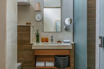 a bathroom with a mirror and sink