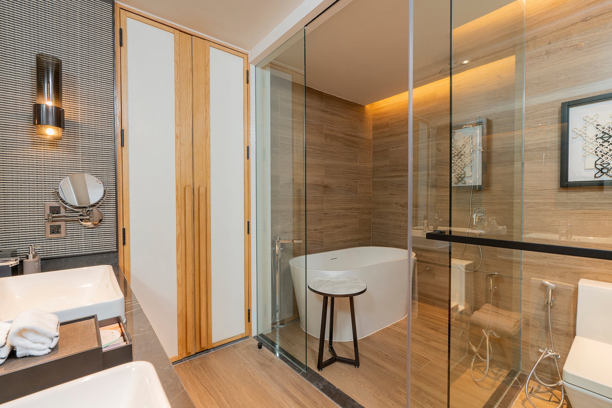 a bathroom with a glass shower door and a tub