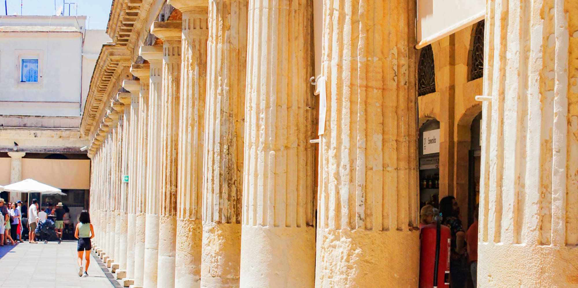 a building with columns and a sign