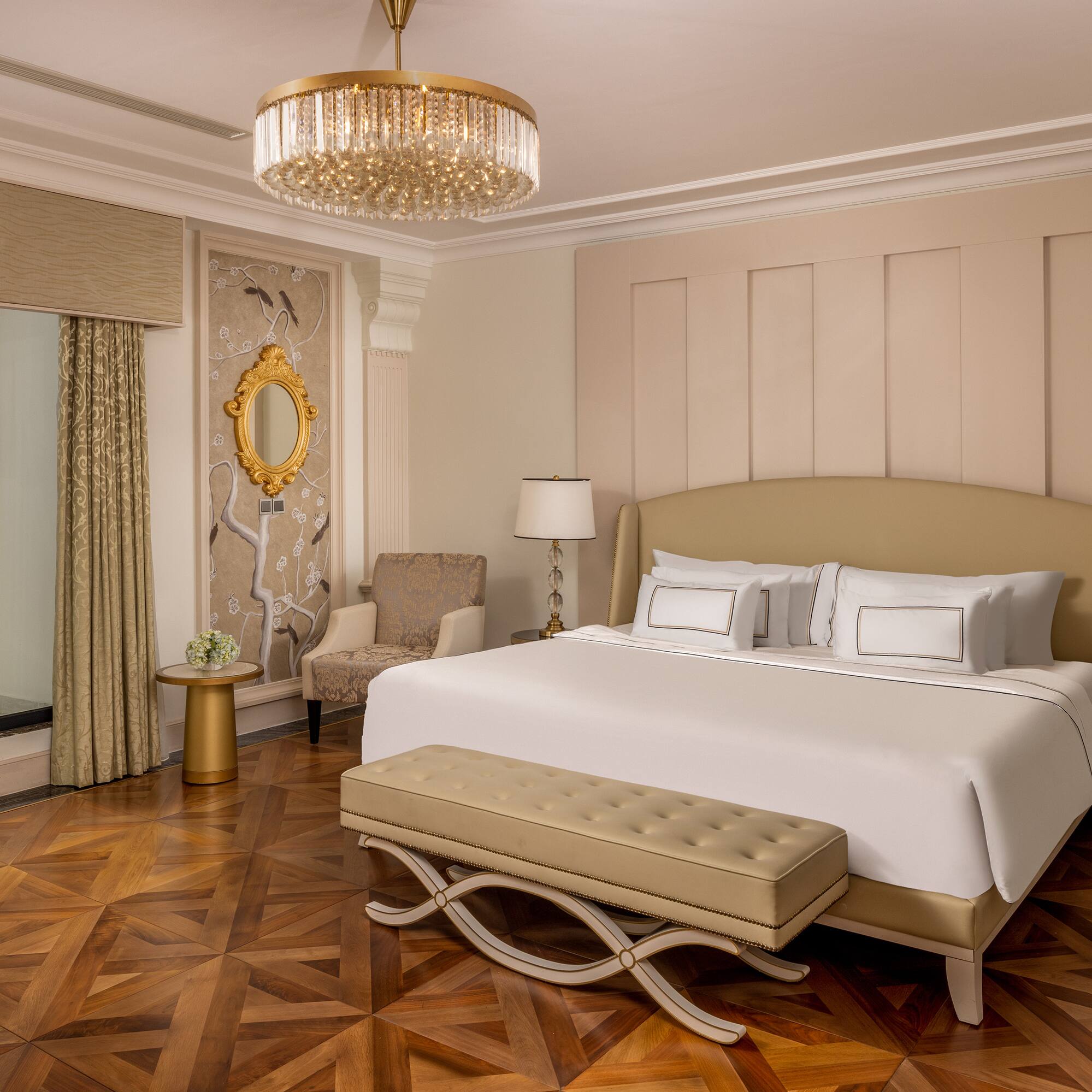 a bedroom with a bed and a chandelier