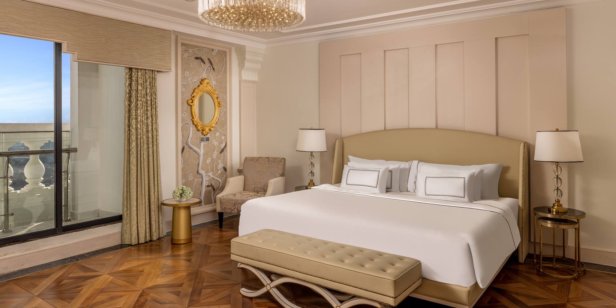 a bedroom with a bed and a chandelier